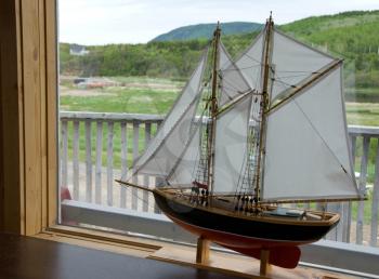 Royalty Free Photo of a Model Ship in a Window