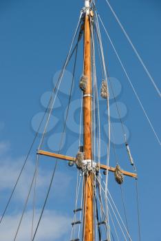 Royalty Free Photo of a Mast Against a Blue Sky
