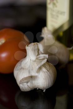 Royalty Free Photo of Garlic, Tomato and Olive Oil