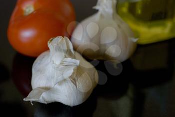 Royalty Free Photo of Garlic, Tomato and Olive Oil