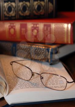Royalty Free Photo of a Reading Glasses and Old Books
