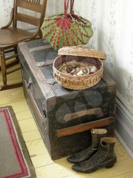 Royalty Free Photo of a Sewing Basket, Old Boots and a Trunk
