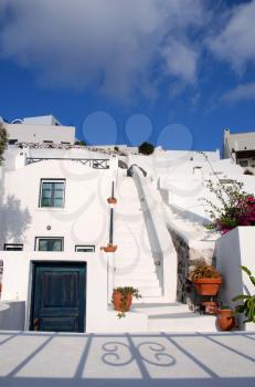 Royalty Free Photo of a White Stairway With Terra Cotta Pots
