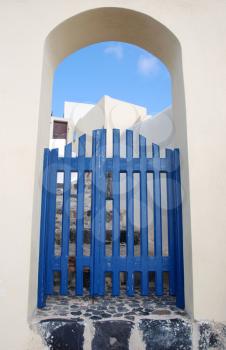 Royalty Free Photo of an Archway and Gate in Santorini