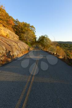 Royalty Free Photo of a Paved Road in Autumn