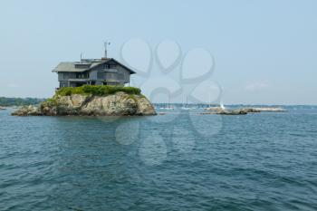 Royalty Free Photo of a House on an Small Island