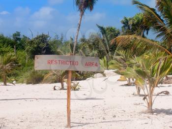 Royalty Free Photo of a Sign on a Tropical Beach