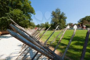 Royalty Free Photo of a Wooden Fence Fallen Over
