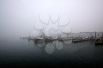 Fishermen's wharf covered in dense morning fog.