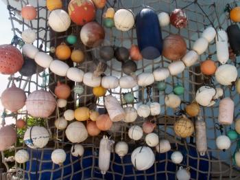 Colorful fishnet floats on the caribbean beach.