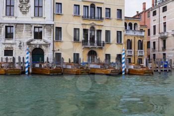 Venice, Italy - April 1, 2013: Street views of canals and ancient architecture in Venice, Italy. Venice is a city in northeastern Italy sited on a group of 118 small islands separated by canals and li