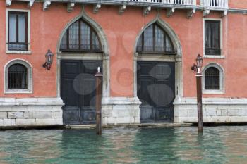 Venice, Italy - April 1, 2013: Street views of canals and ancient architecture in Venice, Italy. Venice is a city in northeastern Italy sited on a group of 118 small islands separated by canals and li