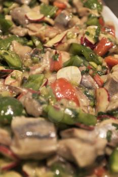 Marinated herring salad, close-up view.
