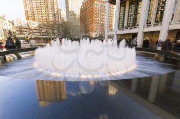 New York City, USA-April 2, 2017: View of Lincoln Center's Revson Fountain, probably the most recognizable destination for visitors and locals.
