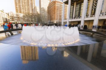 New York City, USA-April 2, 2017: View of Lincoln Center's Revson Fountain, probably the most recognizable destination for visitors and locals.