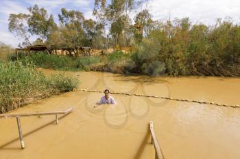 Qasr el Yahud, Israel- March 14, 2017: Qasr el Yahud is the official name of a baptism site on the Jordan River that is egally part of the State of Palestine, but under Israeli occupation, visited by 500,000 pilgrims annually.