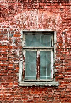 window and brick wall of old house