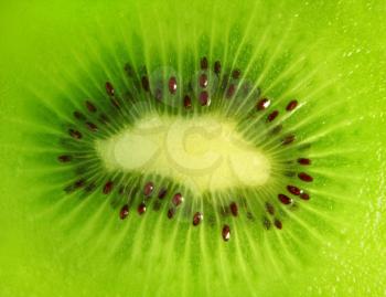 close-up of a kiwi fruit inside with seeds