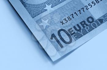 fragment of ten euro money, blue abstract background