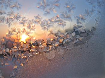 frost and sun on winter glass background