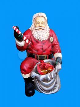 christmas statue of santa claus isolated on the blue background