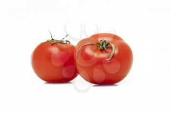 two red sweet tomatoes on a white background