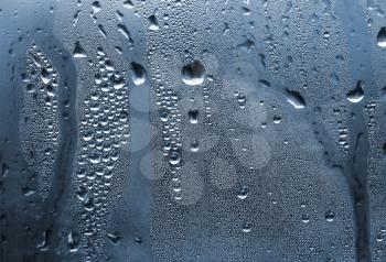 natural large and fine water drops on glass