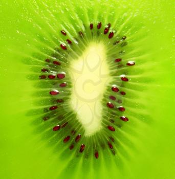 close-up of a kiwi fruit inside with seeds   