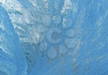 blue frosty natural pattern on winter window glass