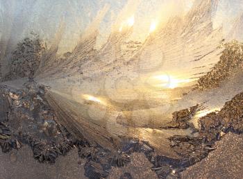 frost and sun on winter window 