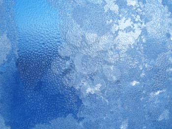 frozen water drops on winter windowpane