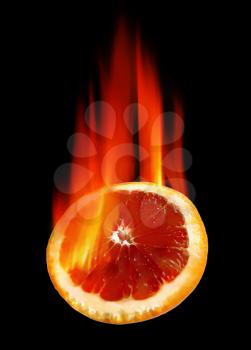 burning orange in hot fire on black background         