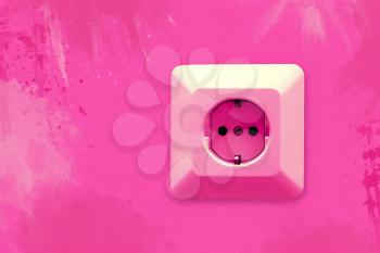 electric socket on pink wall with blots