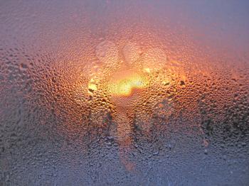 natural water drops and sunlight on window glass