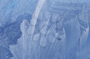 blue ice pattern on winter glass