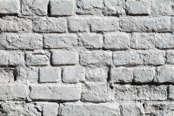the painted grey old brick wall