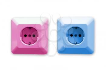 pink and blue electric sockets on white background