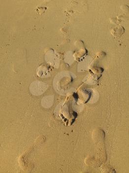 Sea sand with footprints texture 