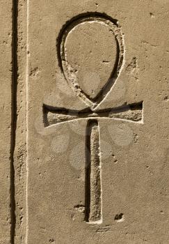 Ancient egypt symbol Ankh (Key of Life, Eternal Life, Egyptian Cross) carved on the stone in the Karnak Temple, Luxor