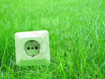 Royalty Free Photo of an Outlet in Grass