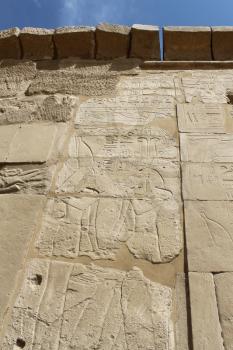 Ancient wall with images in the Karnak Temple, Luxor, Egypt
