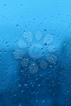 Natural water drops on window glass