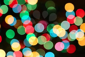 Holiday night background with colorful unfocused lights