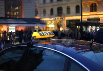 Closeup of city Taxi sign at night 