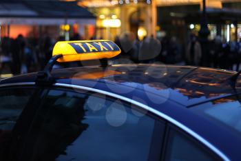Closeup of city Taxi sign at night 