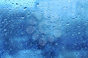 Background with natural water drops on window glass