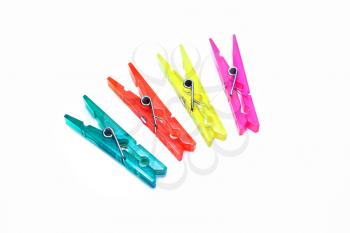 Bright colorful clothespins on a white background
