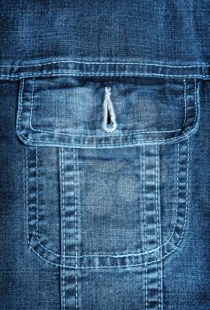 Blue jeans jacket pocket closeup