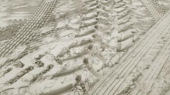 Wheel track on the white sand background