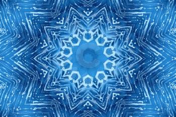 Blue background with concentric abstract pattern of soap foam on glass